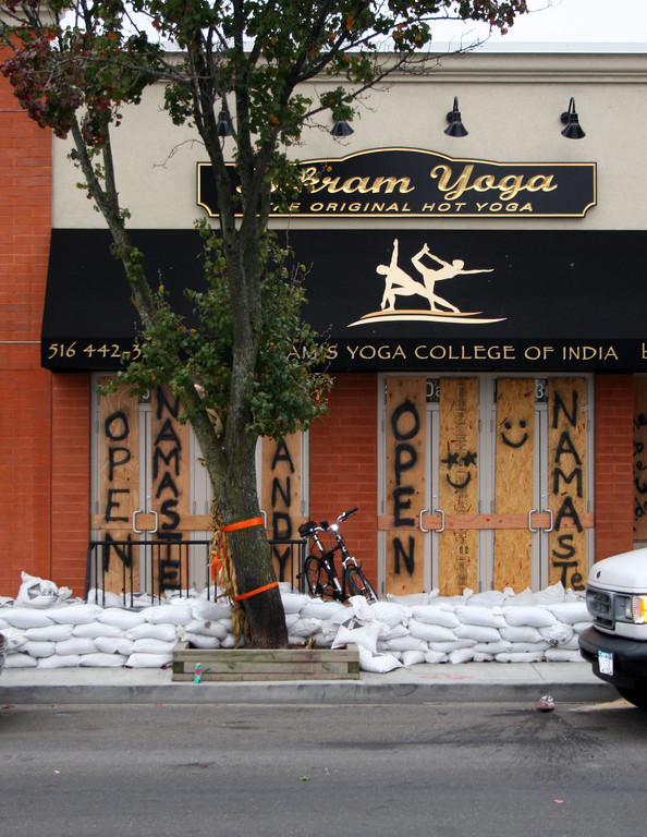 Bikram Yoga on Park Avenue boarded up and put sandbags in front of the business. Officials are expecting significant flooding.