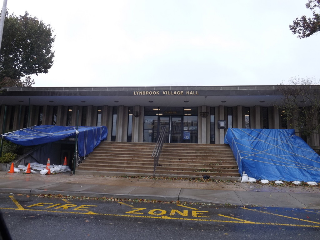 Lynbrook Village was closed Monday and tarps were placed over a section of the staircase in the front of the building and the Lynbrook Police Department entrance.