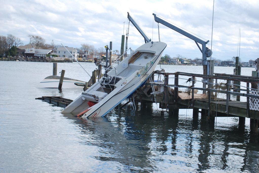 A Boat was shoved up on a dock off Northern Boulevard in Baldwin Harbor.