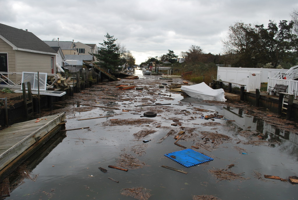 Canals in Bay Colony off of Norther Boulevard were filled with debris.