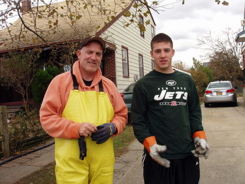 Joe Lores and his son, Mike, helped family pump out their basement on Rhame Avenue