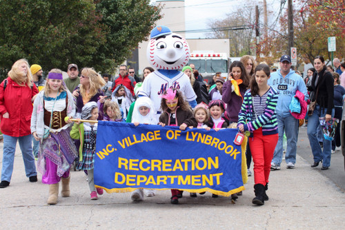 A parade of children and adults made its way down St. James Place.