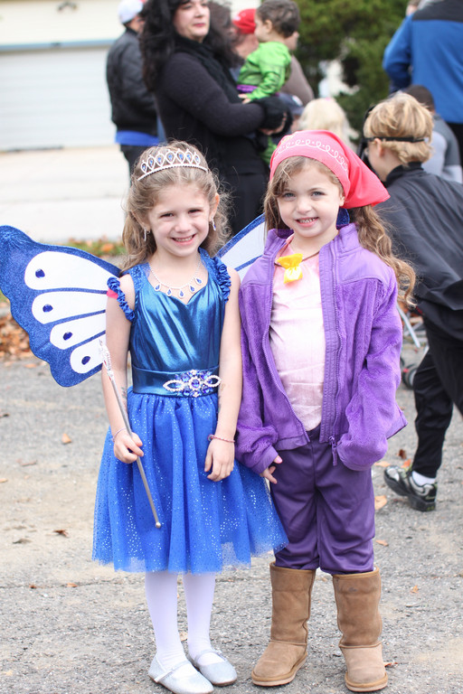 Rachel Stein (left) and Rebecca Murphy, both 5, dressed up in costume and awaiting the start of the parade.