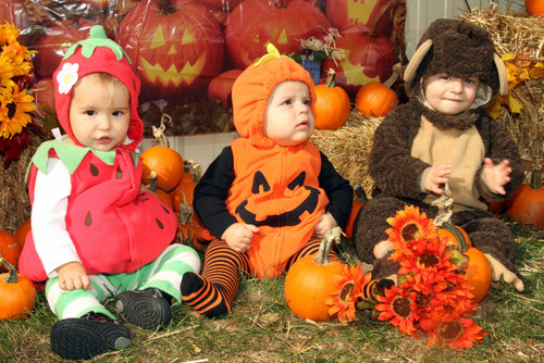 three cuties: In East Rockaway, Gracie Dillard, 1, Joseph Giordano, 8 months, and Brody Marasco, 1, came dressed as a strawberry, a pumpkin and a clapping monkey.