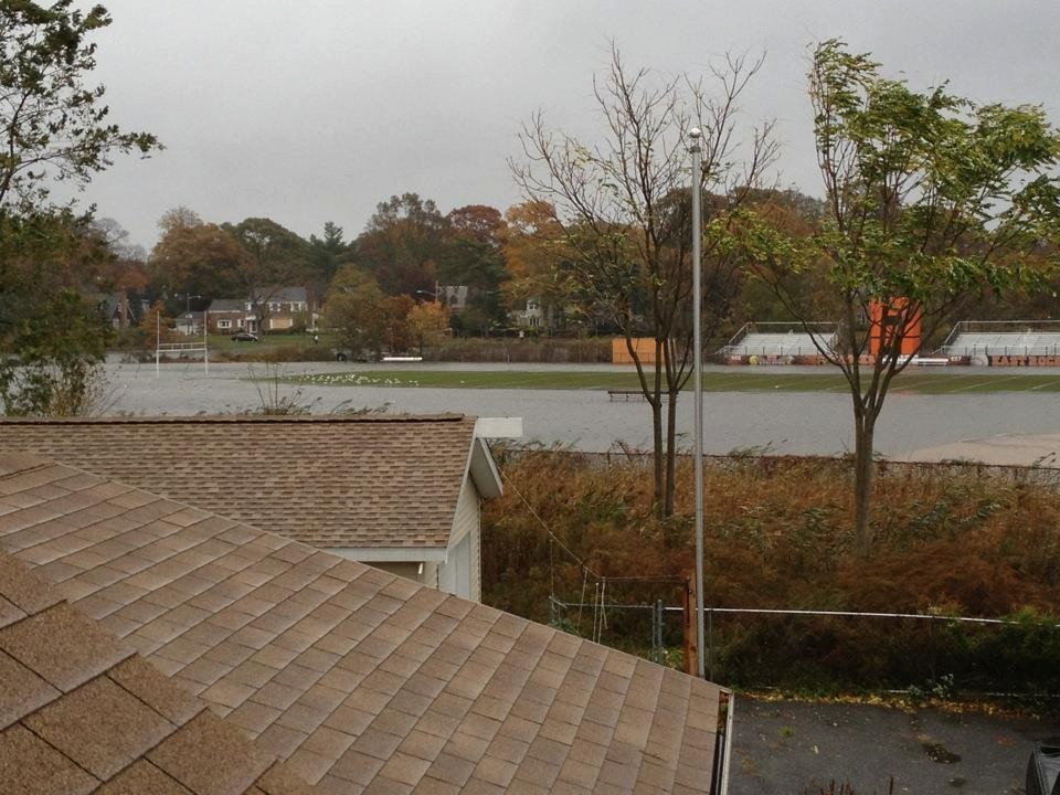During the storm, water filled the football field behind East Rockaway High School and headed toward the school itself.