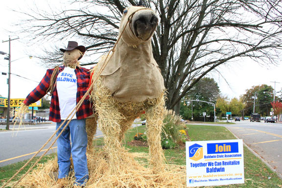 The scarecrows, which went up briefly pre-Sandy but were removed to protect them from the storm, have now been returned to the sidewalks and grassy medians of Baldwin, where they will frighten crows until Nov. 25.