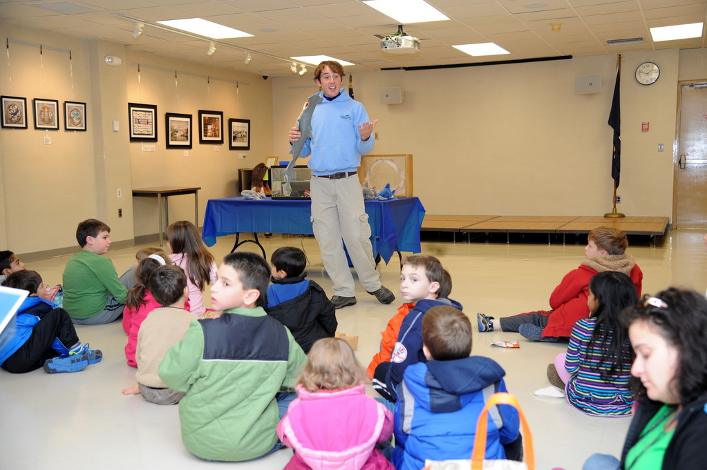 Chris Brady, from the Long Island Aquarium in Riverhead, spoke to kids about sharks during the opening day of the East Meadow Public Library’s Discover Earth exhibit. Brady brought live chain catsharks for the children to observe.