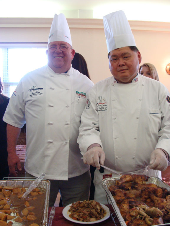 CHEFS Chris Neary, left, and Michael Ty of the American Culinary Federation served some delicious fare to the attendees.
