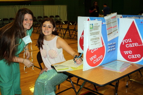 The Lynbrook High School Leadership/Key Club sponsored a holiday blood drive. Leadership/Key Club officer Dana Fader (left) helped Ally Sanchez fill out her paperwork before she donated blood.