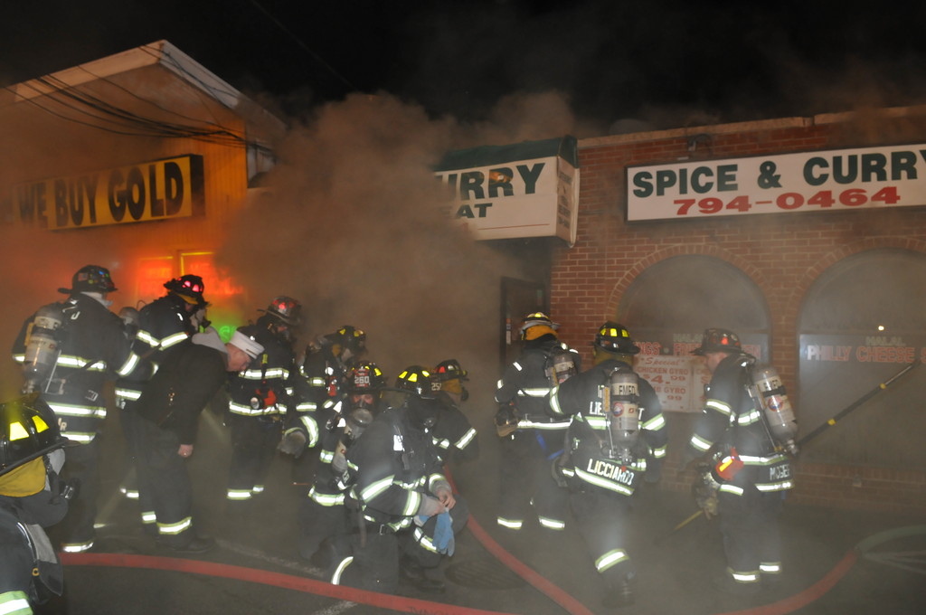 Firefighters responded to a commercial fire at Spice and Curry on Hempstead Turnpike on New Year's Day. The fire spread to two adjoining businesses before being controlled by firefighters.