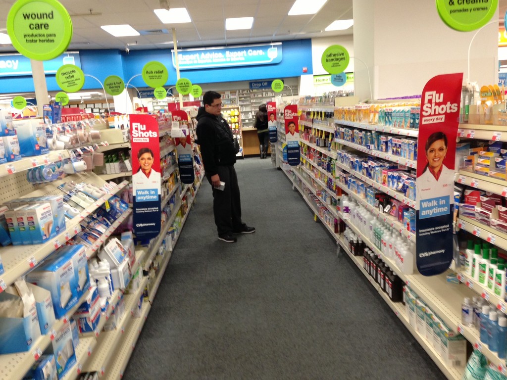Customers seek relief with over-the-counter remedies to lessen their flu symptoms.