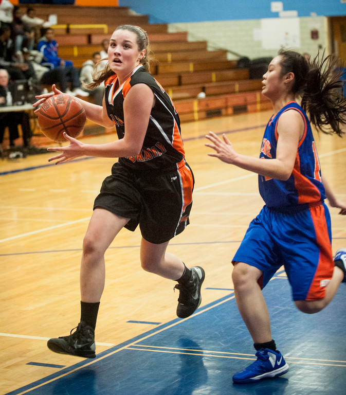 East Rockaway's Kim McCann, left, had nine points and 15 rebounds in the team's 37-31 Conference B-C victory at Malverne.