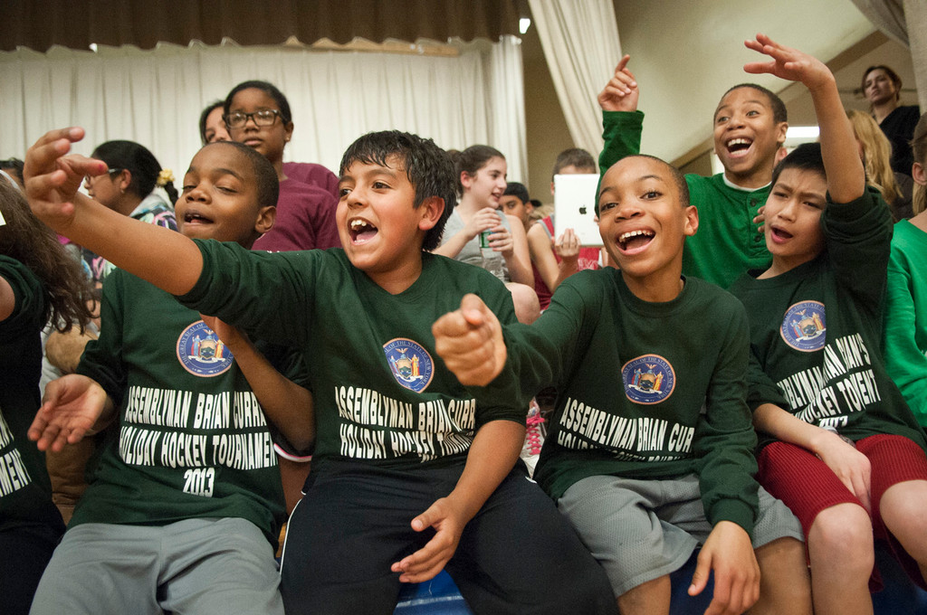 Students from the William L. Buck School cheer on their classmates.