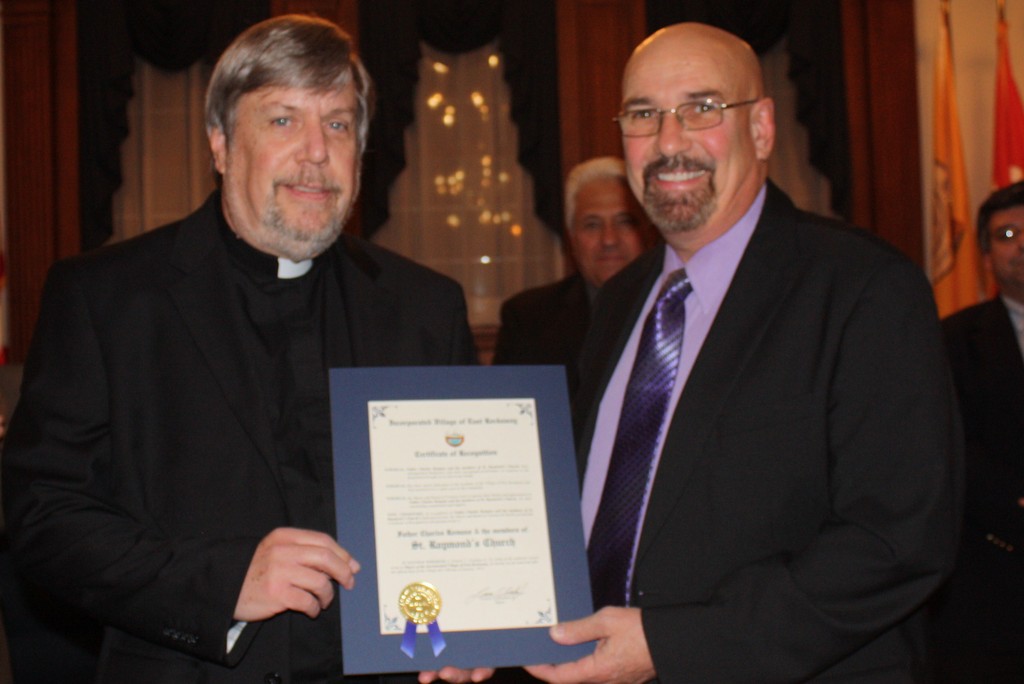 Local spiritual leaders were awarded with citations. Pictured were Father Charles Romano of St. Raymond's Church and Mayor Francis T. Lenahan