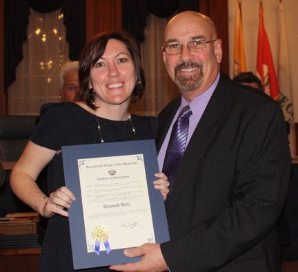 Elizabeth Daitz accepted her certificate from Mayor Francis T. Lenahan.