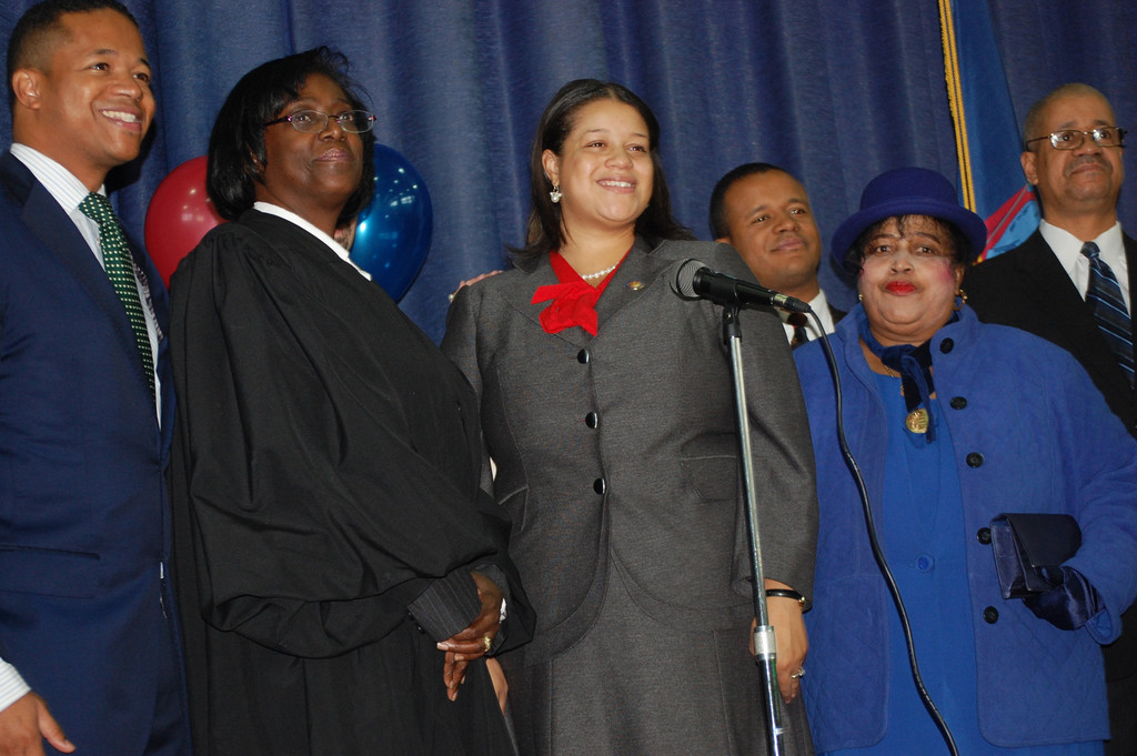 Assemblywoman Michaelle Solages, center, took the oath of office at a ceremonial inauguration at the Dutch Broadway School in Elmont last Friday. Joining her were, from left, her brother Carrié, Judge Michele Woodard, Solages’s brother Philippe Jr., and their parents, Micheline and Philippe.