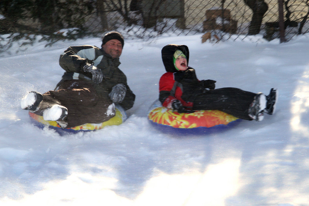 Michael and Gavin Gulino tube at James A. Dever school's parking lot.