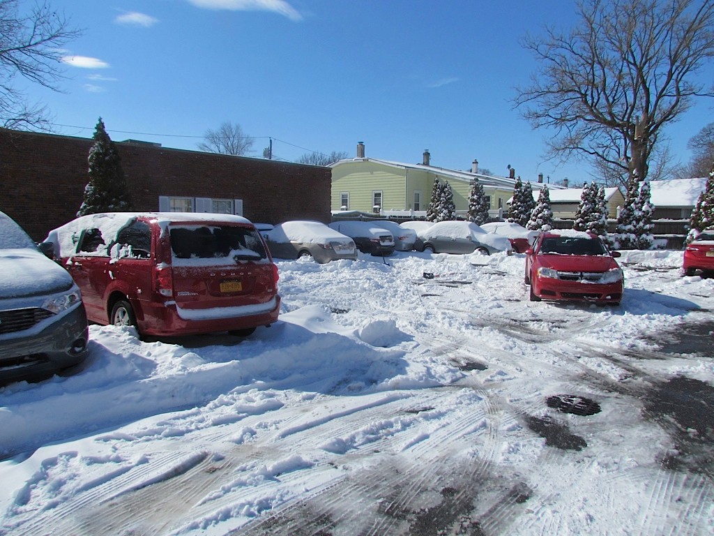 Cars made their way through the snow on Saturday in Valley Stream.
