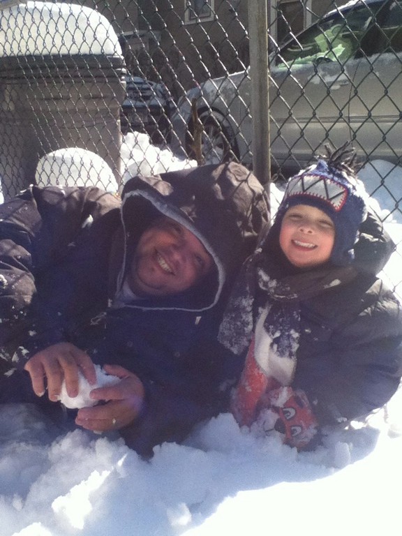 Joaquin Gallardo,4 and his father, Angel, played in the snow outside their Catherine Street home.