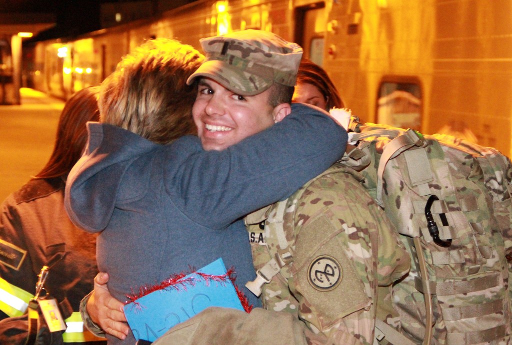Steven Liguori got a tight hug from his mother, Liz, at the LIRR station in Lynbrook upon his arrival from Fort Dix in New Jersey.