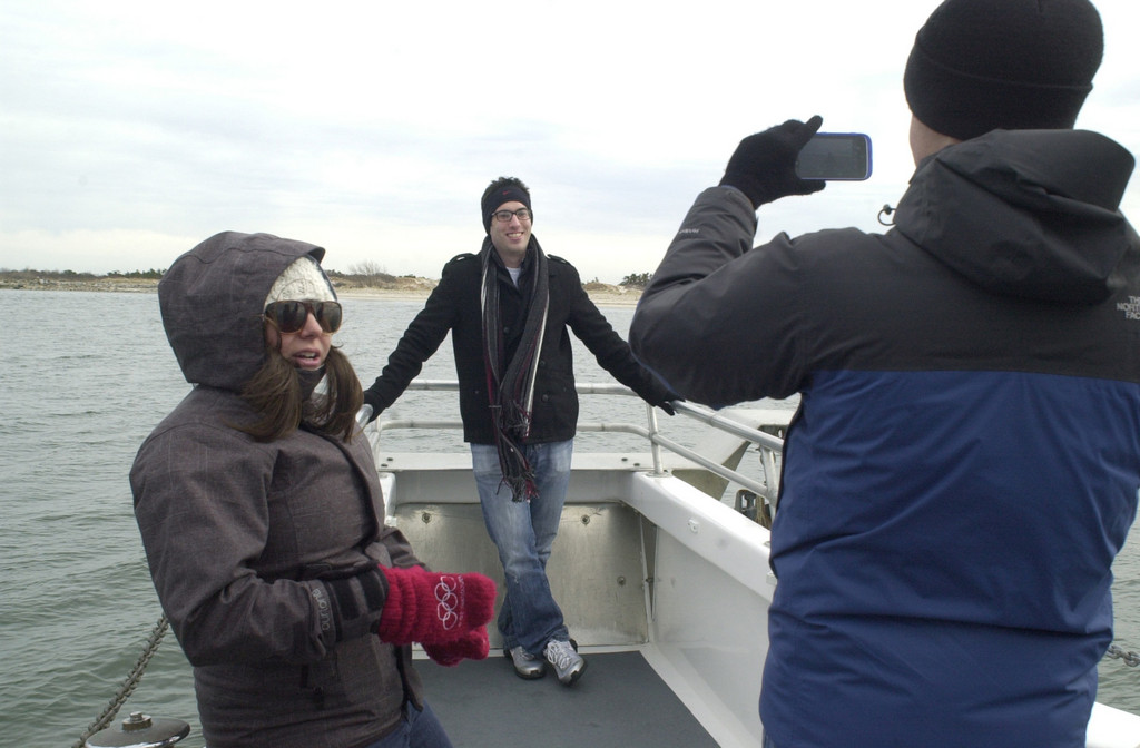 Merrick Herald reporter Brian Racow, front, took a shot of East Meadow Herald Editor David Weingrad at the bow of the Capt. Lou VII, with Long Beach reporter Alexandra Spychalsky at left.