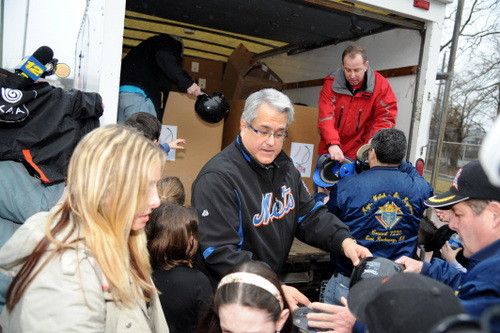Councilman Anthony Santino lends a hand.