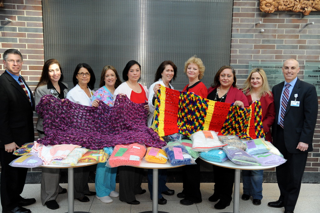 Baldwin Life Stitches, a charity crafting group, donated blankets to the South Nassau Communities Hospital recently. Above, from left, were the hospital’s Chaplain Allen Siegel, Gayle Somerstein (nursing director), Misako Miller (maternity coordinator), Theresa Groder (nurse), Aimee Pontrelli (Life Stitches founder), Alyson Ornstein (nurse), Kacey Verity, Doreen Bennett and Jacoba Evans of Life Stitches and Joe Lamantia of SNCH.