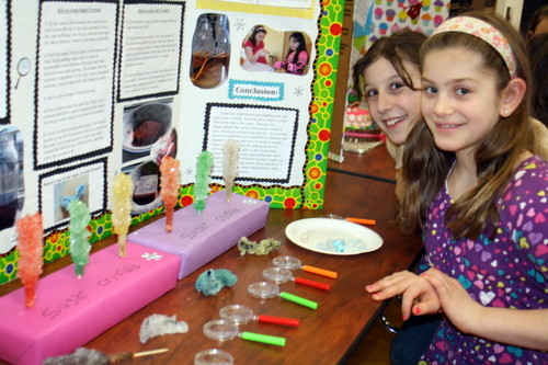 For their experiment at the West End School science fair in Lynbrook, fourth-graders Marianne Lombardo (left) and Gabrielle Grillo compared the properties of salt and sugar crystals.