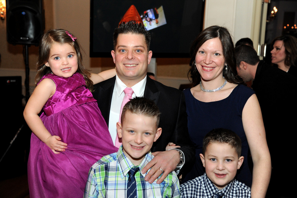 The Ambrosios: Danny and Kelly with their children Kelsey, 3, Christopher, 8, and Connor, 7.