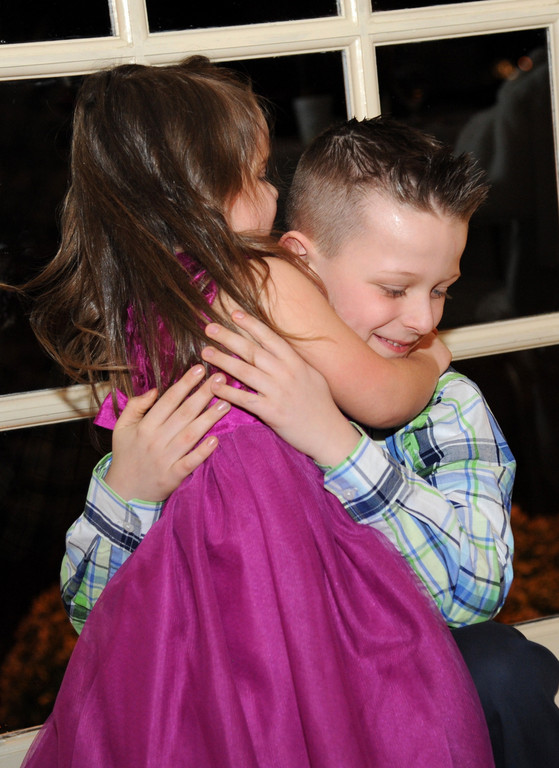 Christopher gave his sister, Kelsey, a hug.