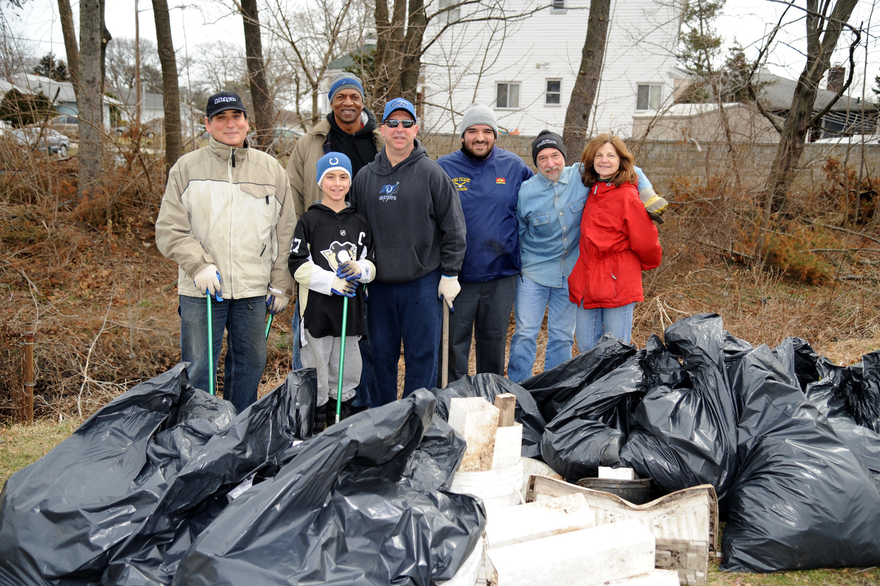 Several Valley Stream residents helped clean up a stream in North Valley Stream last Sunday morning. From Left are Nick Spaventa, Everett Gamory, Brian Milone, Victor Milone, David Sabatino, Bob and Joan Cesario.