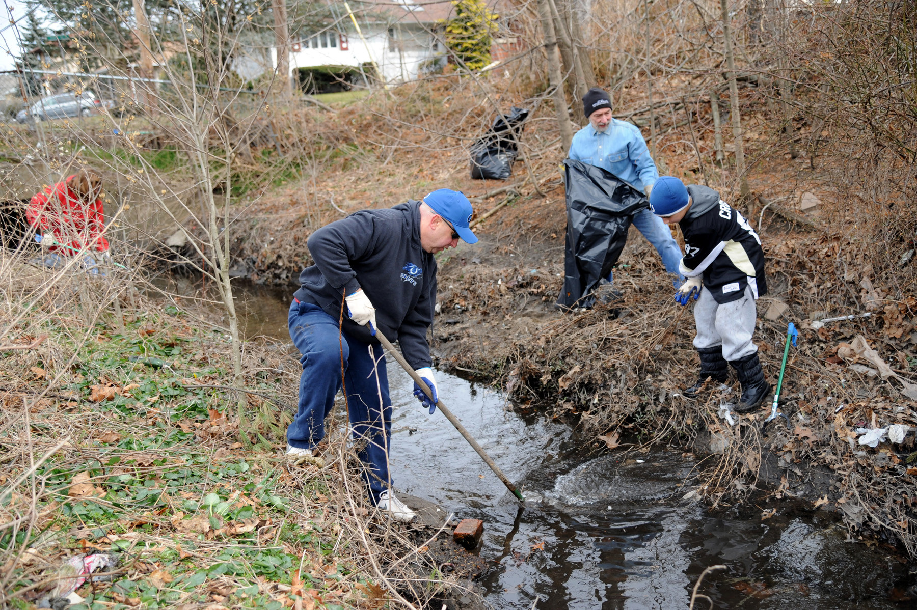 Victor Milone, Bob Cesario and Brian Milone, 13, helped clean up.