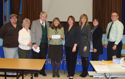 Education foundation members Dan Caracciolo, Jane Brezenoff and Richard Meagher, from left, presented the second of three checks to the East Rockaway School District. Holding the $50,000 check is Superintendent Roseanne Melucci; School Board President Kristin Ochtera, Secretary Patti Nicoletti, Vice President Linda Schmidt, and Trustee Neil Schloth.