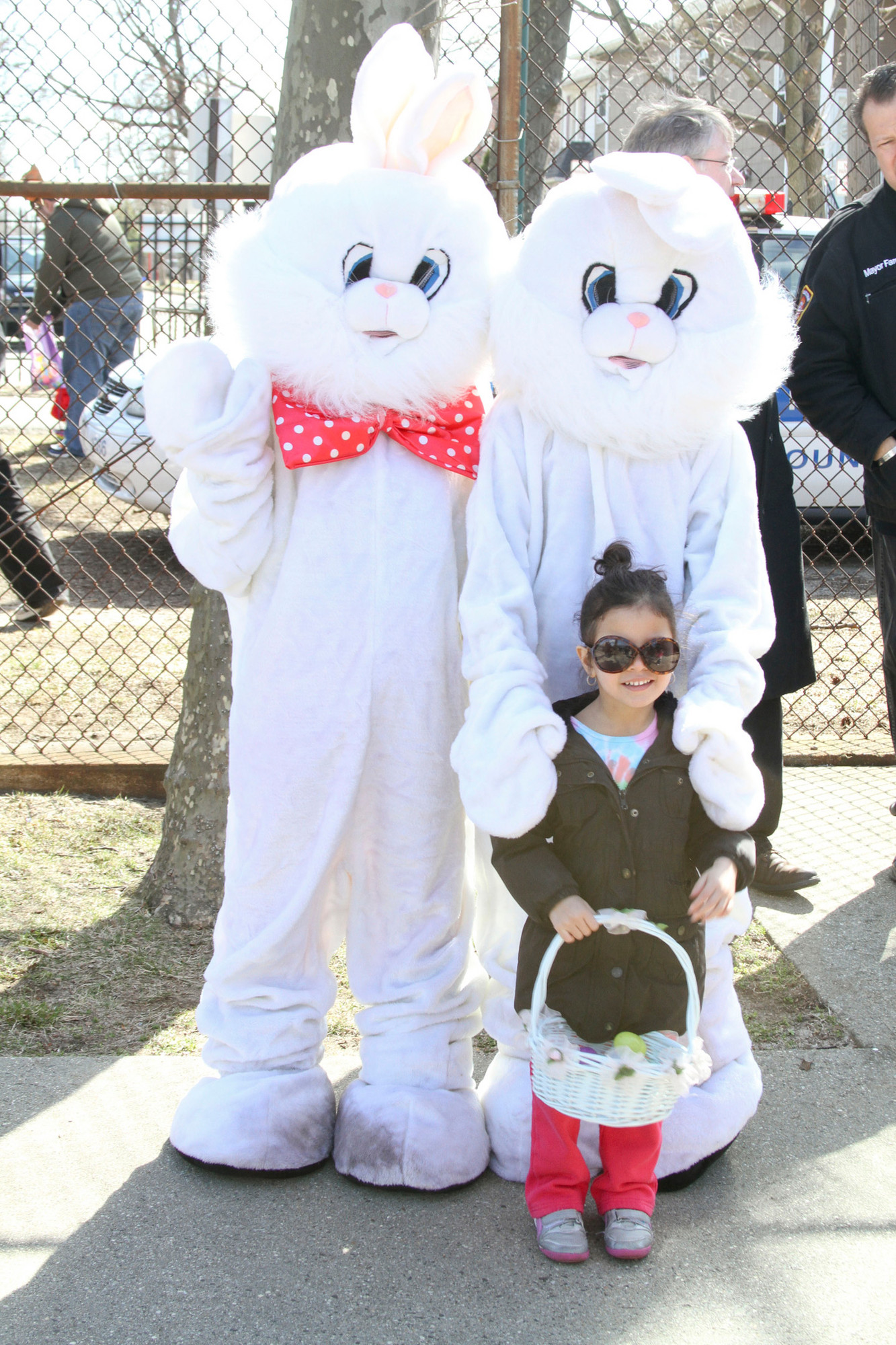 Liliana Ortiz, 4, with Mr. and Mrs. Easter Bunny played by volunteers from the Valley Stream Youth Council.