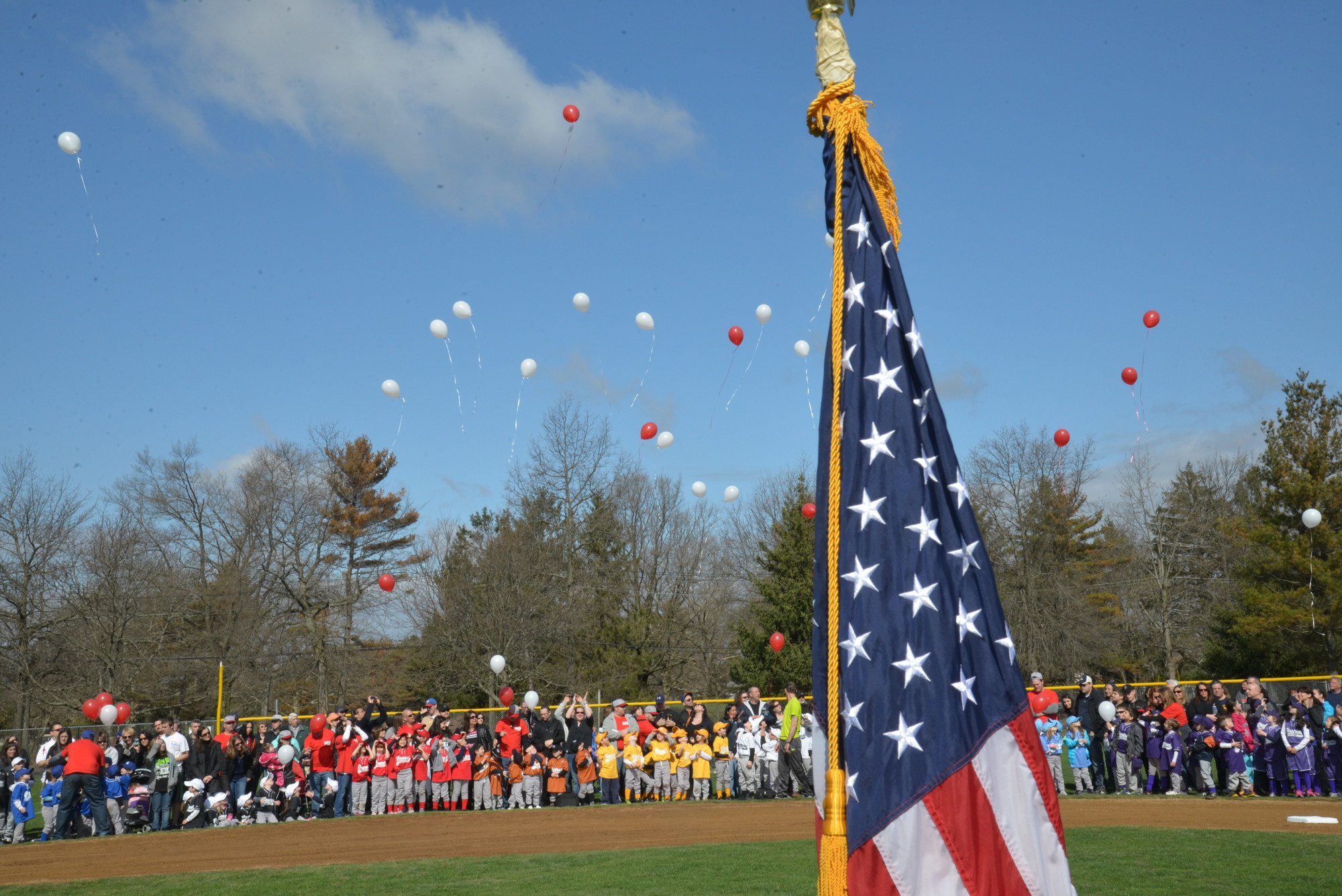 During its annual parade last Saturday, members of the Central Nassau Little League Association released balloons to commemorate Harlie Treanor, a former Little Leaguer who died last July. Story, more photos, page 3.