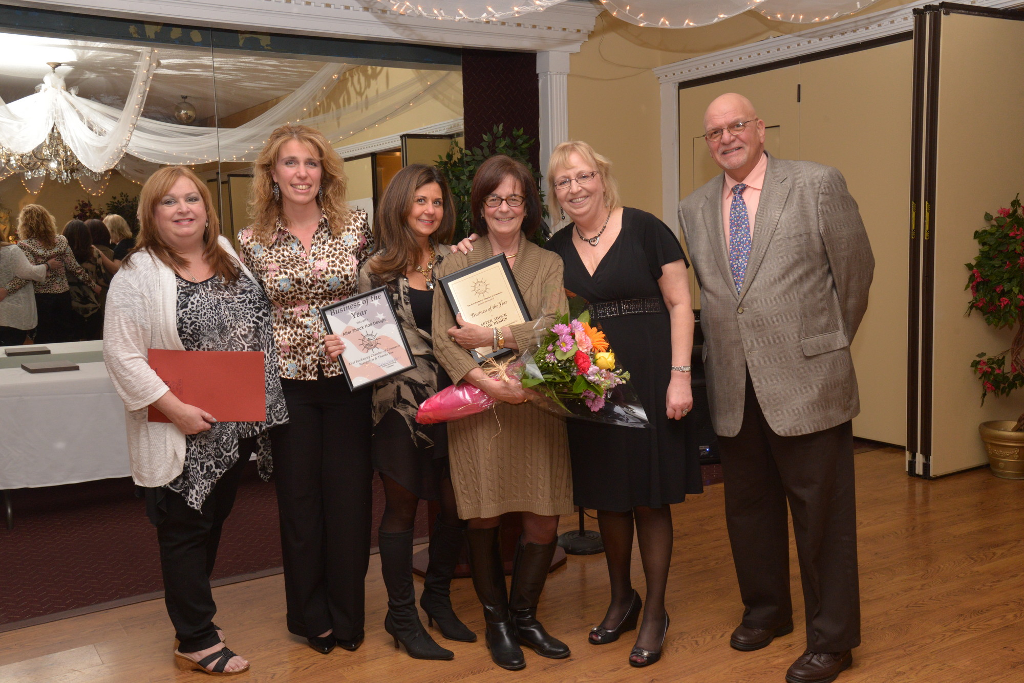 after Shock hair design was one of two Businesses of the Year. Pictured from left were Rose Anne Strife, Gilda Briguglio, Kathy DeAngelis, Nancy Duka, Chamber President Debbie Hirschberg, and the Chamber’s Public Relations Specialist Charlie D’Agostino.