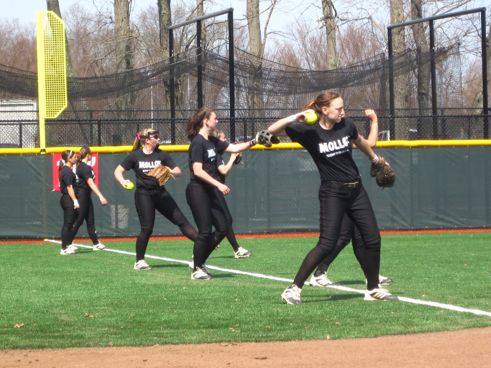 Molloy Softball players warmed up their wind-ups and practiced their pitching at the new Bob Klein Softball Field on Peninsula Boulevard.