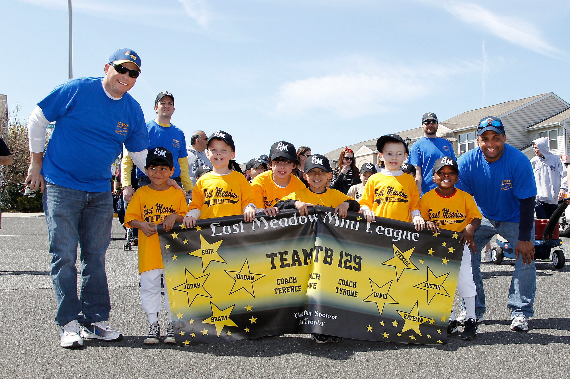 The East Meadow Tee Ball Team No. 129 marched the parade with their coaches.