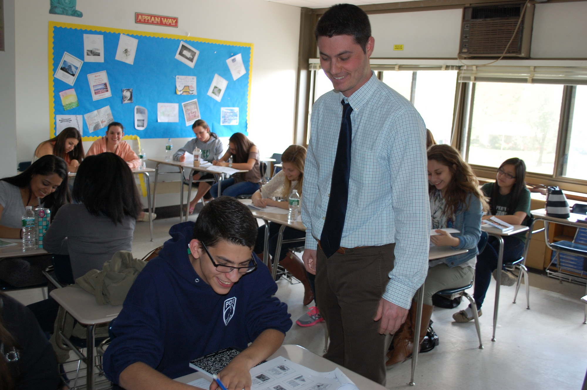 North High School teacher Dan Ryan meets with students in his Advanced Placement psychology class, who recently took the AP test. For some in the class, it was just one of five of the college-level exams they are taking this year.