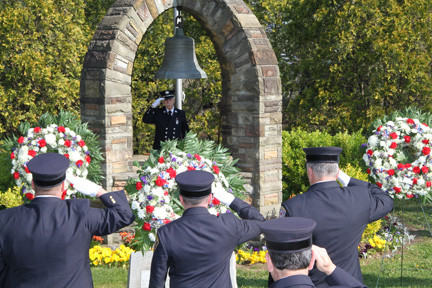 Lynbrook Fire Department members saluted at the Firefighters Memorial on Sunrise Highway.