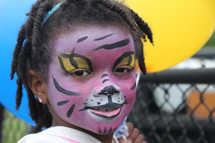 First-grader Alisa
Reid thought the 
inaugural Baldwin Pride and Unity Day was the cat’s meow. 	The event, which organizers hope to turn into an annual affair, was held last Saturday and coincided with Sanitary District 2’s yearly 
Big Sweep cleanup. Pride and Unity Day featured entertainment by local musicians, exhibitions by various Baldwin groups and the 
dispersal of information about Baldwin causes.