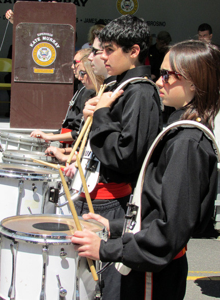 The East Rockaway High School band marches past the reviewing stand.