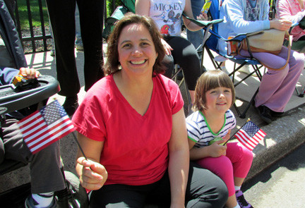 Maria Stadler and her daughter, Melanie, 4, watched the parade from in front of Memorial Park
