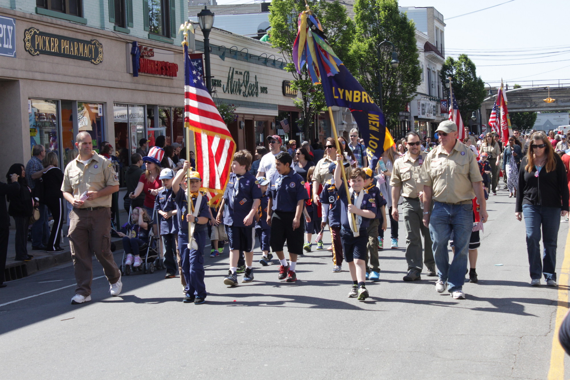 A Boy scout troop proudly displayed their flags in the parade.
