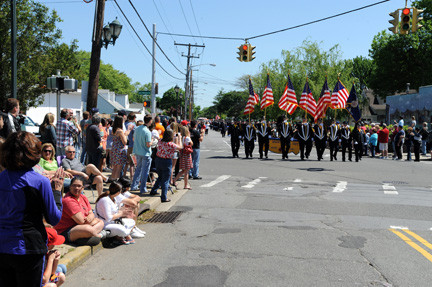 The East Meadow Fire Department Color Guard marched down Prospect Avenue toward Veterans Memorial Park at the conclusion of Monday’s parade.