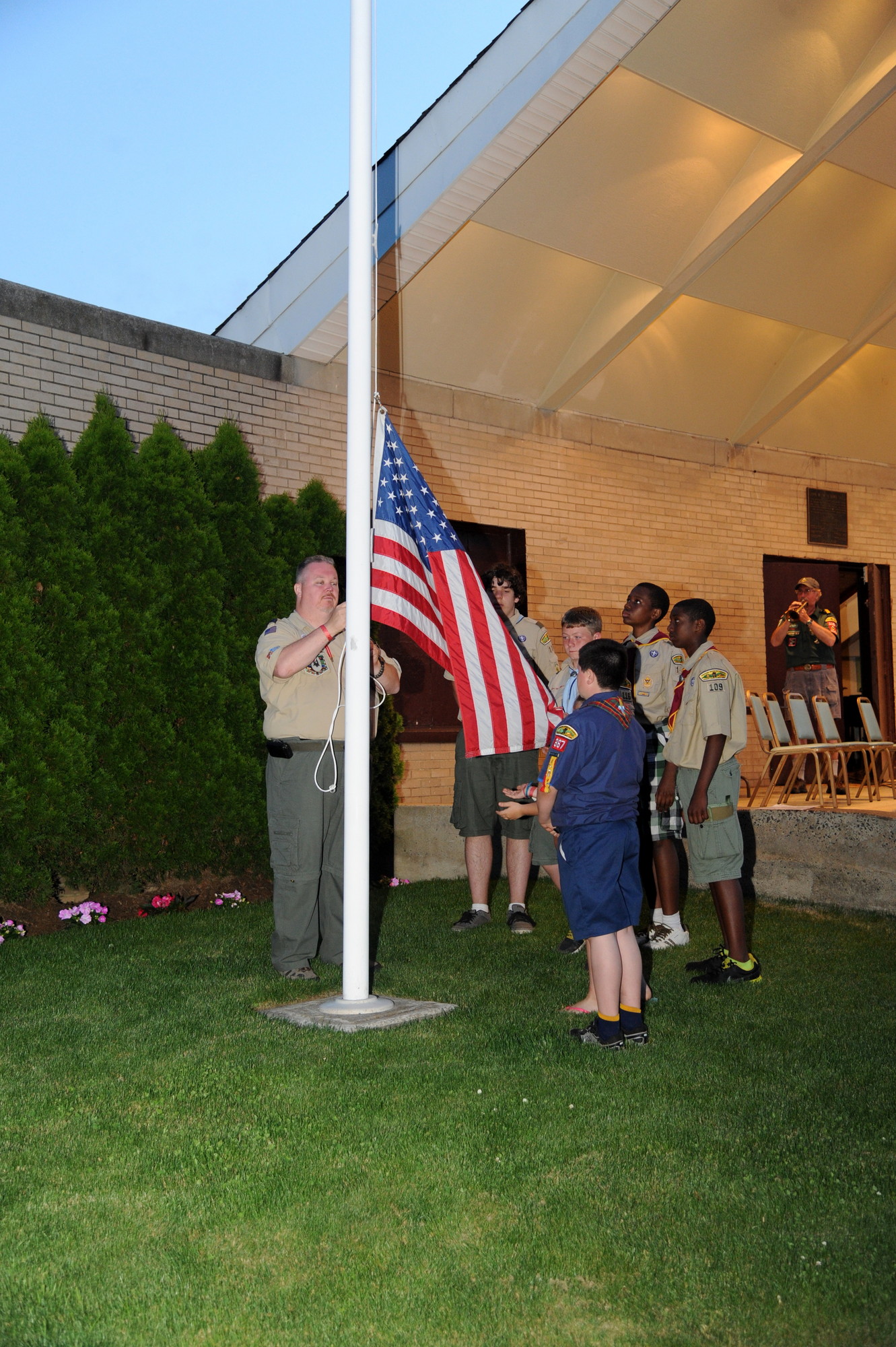 Pack 367 leader Patrick Burke was joined by Valley Stream Cub Scouts and Boy Scouts in retiring the colors last Saturday night during the 33rd annual Scout Camporee on the Village Green.
