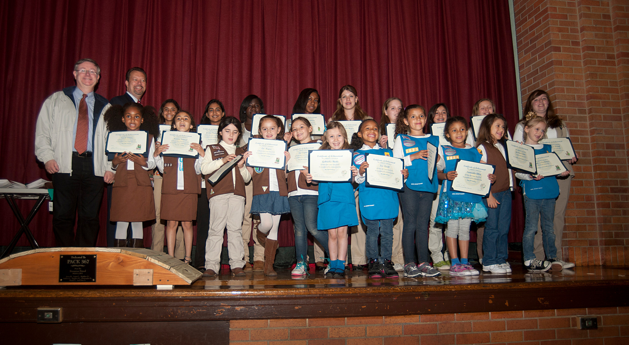 Judge Bob Bogle and Mayor Ed Fare join the many Girl Scouts who received awards on May 24.