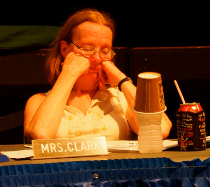 Baldwin Board of Education Trustee Mary Clark looked downcast at an emotional public meeting Friday night. The nurse and long-serving board member eventually voted for a scaled-down school budget — a decision that drew the ire of many in attendance.