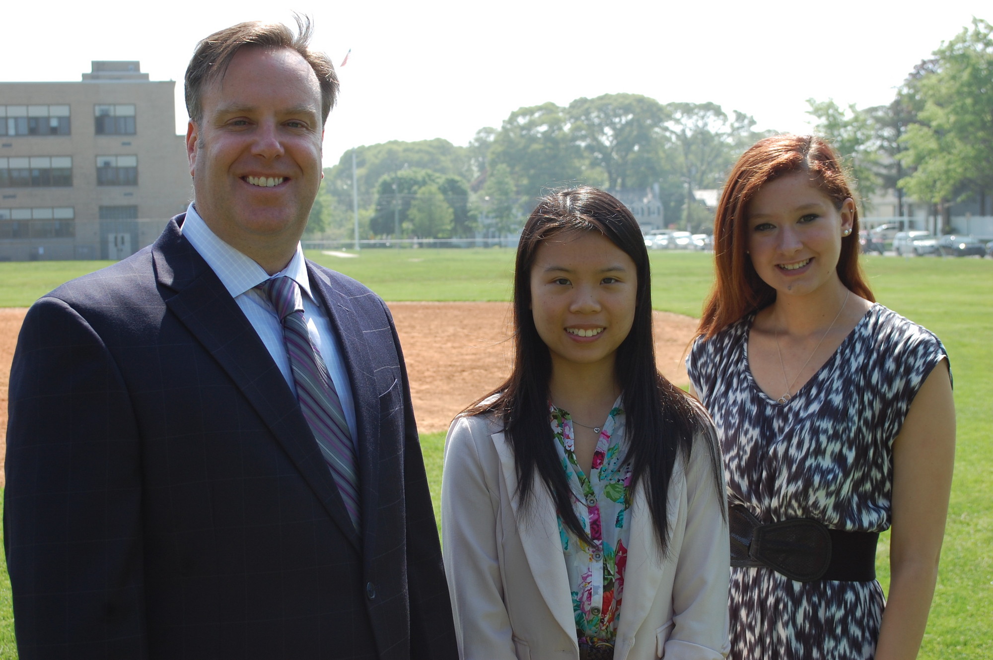 Michelle Chen, center, and Angelica Caluori are the valedictorian and salutatorian, respectively, of North High School’s class of 2013. They are joined by Superintendent Dr. Bill Heidenreich.