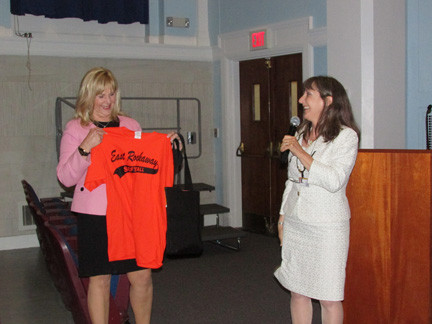 Retiring Superintendent Roseanne Melucci presented Ruiz with a girls’ champions softball T-shirt and an East Rockaway visor, courtesy Coach Joe Lores.